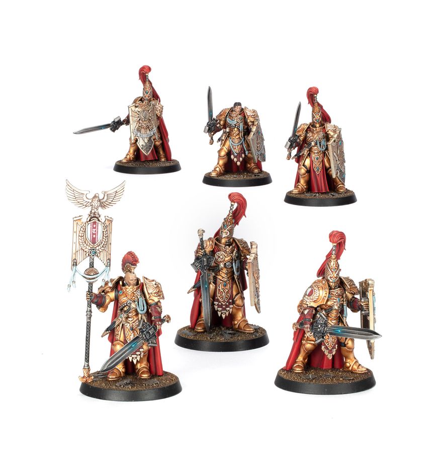 Miniaturas Sentinel Guard de Adeptus Custodes de Warhammer, con armaduras doradas, espadas, escudos y estandarte.