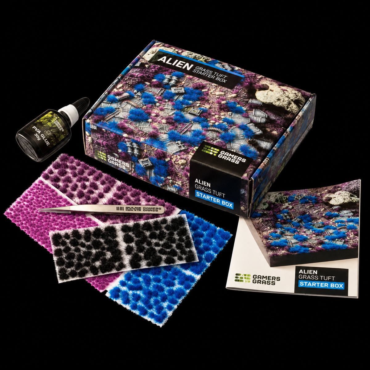 Alien Grass Tuft Starter Box de Gamer’s Grass con caja, matas azules, rosas, moradas y negras, pinzas, pegamento y folleto.