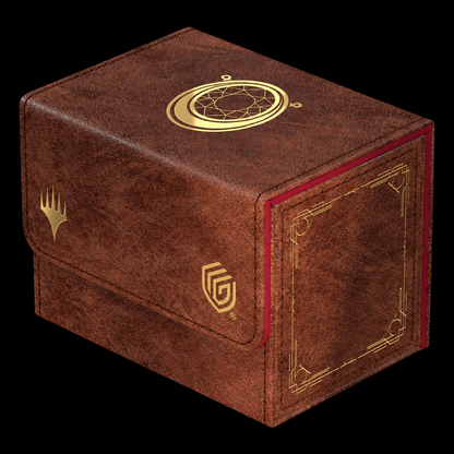 Caja Ultimate Guard Sidewinder 80+ Xenoskin Magic Mox Ruby cerrada, acabado marrón, borde rojo y símbolo de rubí dorado en la tapa.