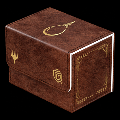Caja Ultimate Guard Sidewinder 80+ Xenoskin Magic Mox Pearl cerrada, acabado marrón, borde blanco y colgante dorado en la tapa.